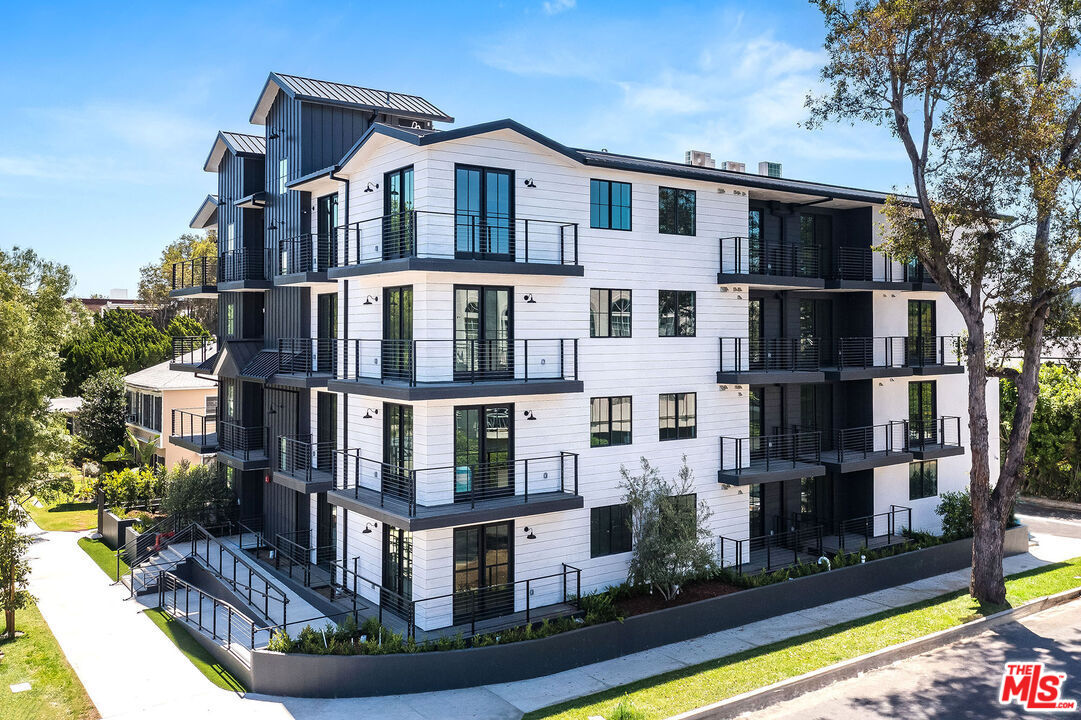 10352 Riverside Drive, Unit 103 Toluca Lake, CA 91602 - Photo 2 of 10 a front view of building with yard