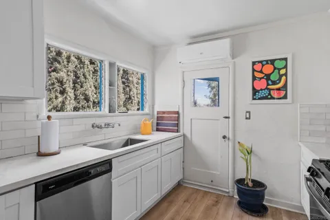 a kitchen with a sink and a stove