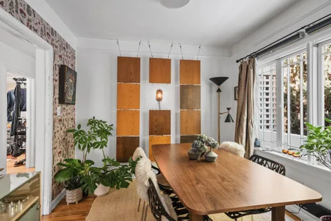 a view of a dining room with furniture window and outside view