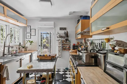 a living room with furniture or couch and a flat screen tv