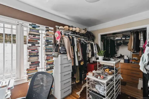 a view of a patio with chairs and a small yard