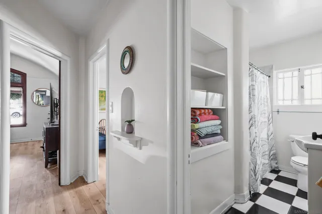 a view of table and chairs under an umbrella