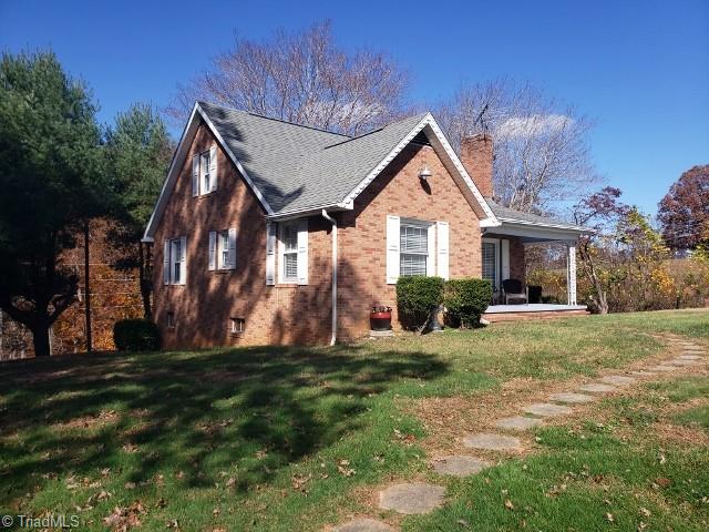 1694 Phillips Road Sandy Ridge, NC 27046 - Photo 2 of 25 Walkway from Carport