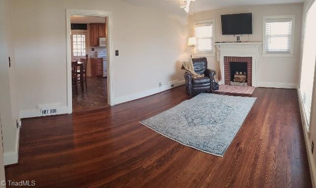 1694 Phillips Road Sandy Ridge, NC 27046 - Photo 3 of 25 Spacious living room with gorgeous hardwood floors.