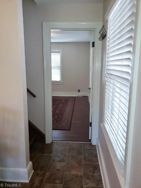 1694 Phillips Road Sandy Ridge, NC 27046 - Photo 8 of 25 From the kitchen, staircase is on the left and a main floor bedroom is straight ahead.