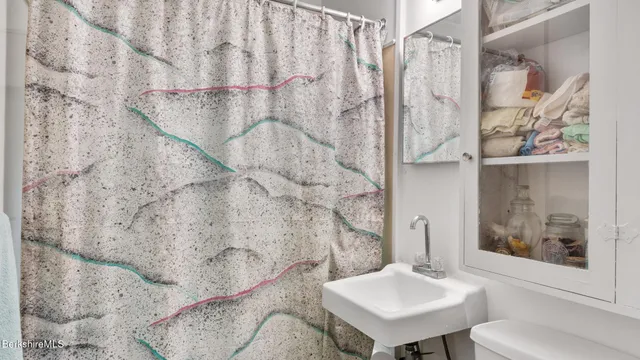 a bathroom with a sink and mirror