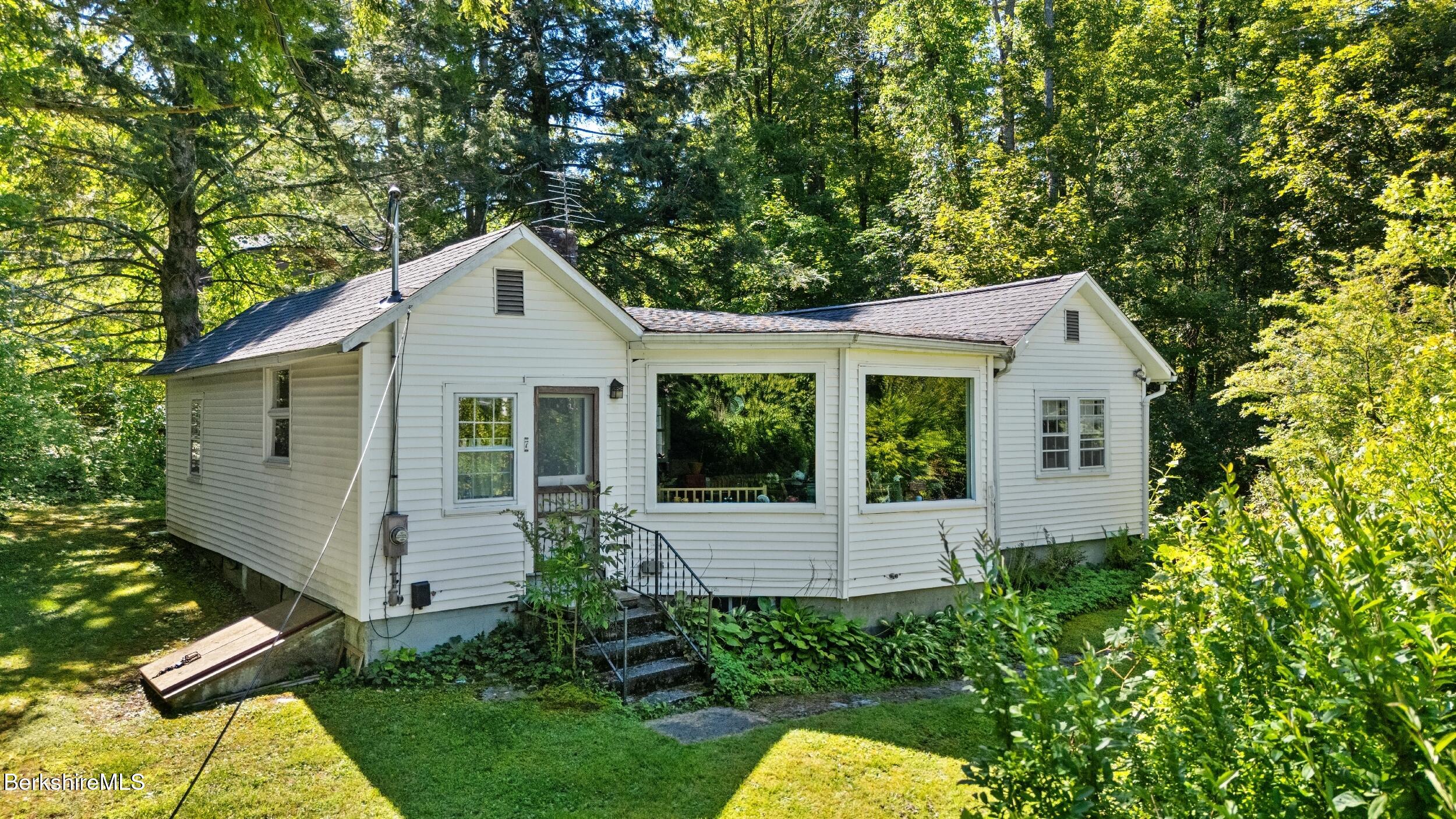 7 Mahkeenac Heights Road Stockbridge, MA 01262 - Photo 2 of 17 a view of a house with a yard plants and large tree