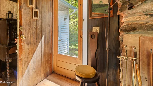 a view of a bathroom with a door and a toilet