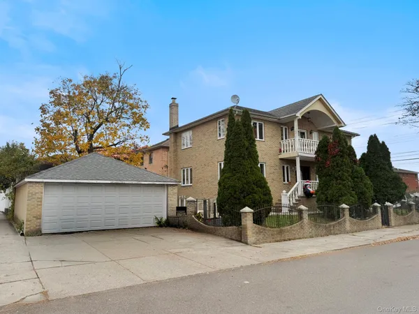 front view of a house with a street