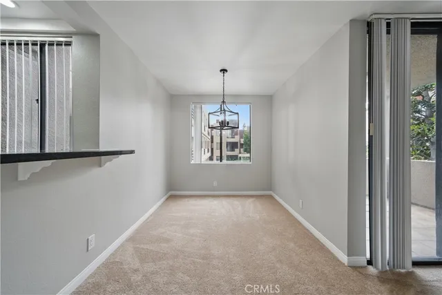 an empty room that has a window in it