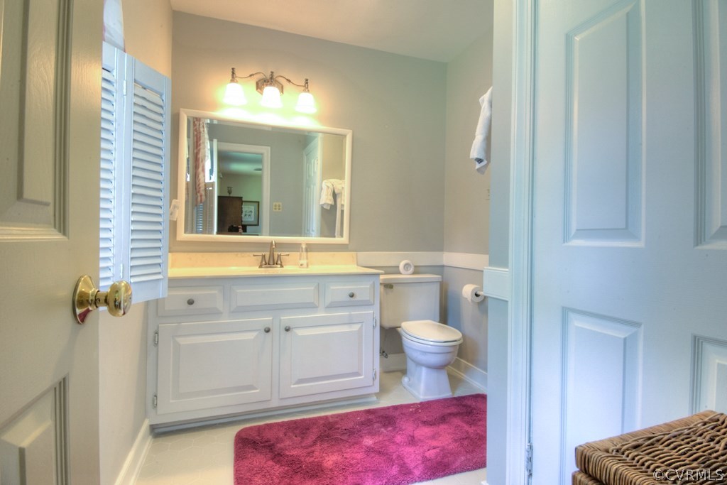 3111 East Brigstock Road Midlothian, VA 23113 - Photo 21 of 32 a bathroom with a sink toilet and shower