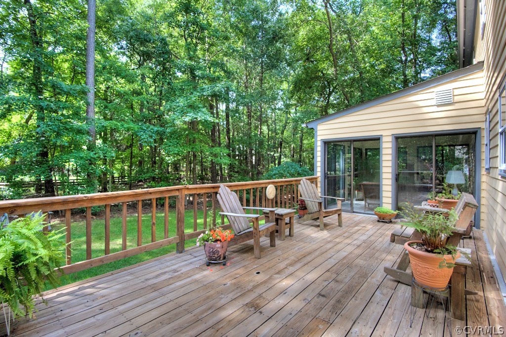 3111 East Brigstock Road Midlothian, VA 23113 - Photo 27 of 32 a view of a chair and table on the wooden deck