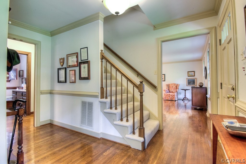 3111 East Brigstock Road Midlothian, VA 23113 - Photo 3 of 32 a view of entryway and hall with wooden floor