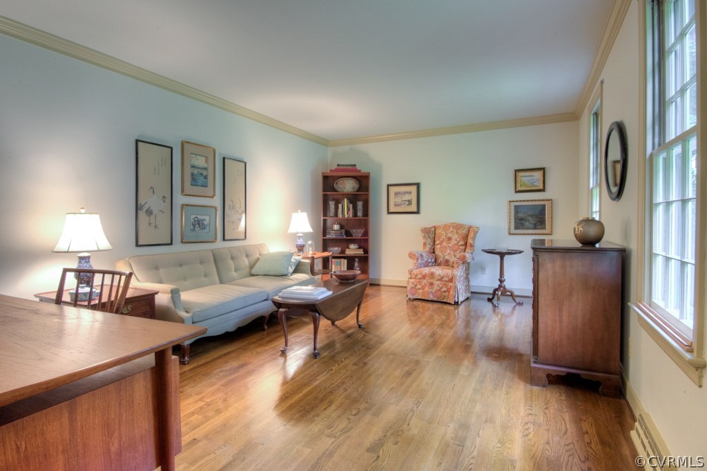 3111 East Brigstock Road Midlothian, VA 23113 - Photo 4 of 32 a living room with furniture and wooden floor