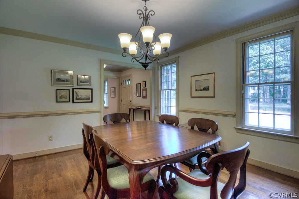 3111 East Brigstock Road Midlothian, VA 23113 - Photo 7 of 32 a view of a dining room with a table and chairs