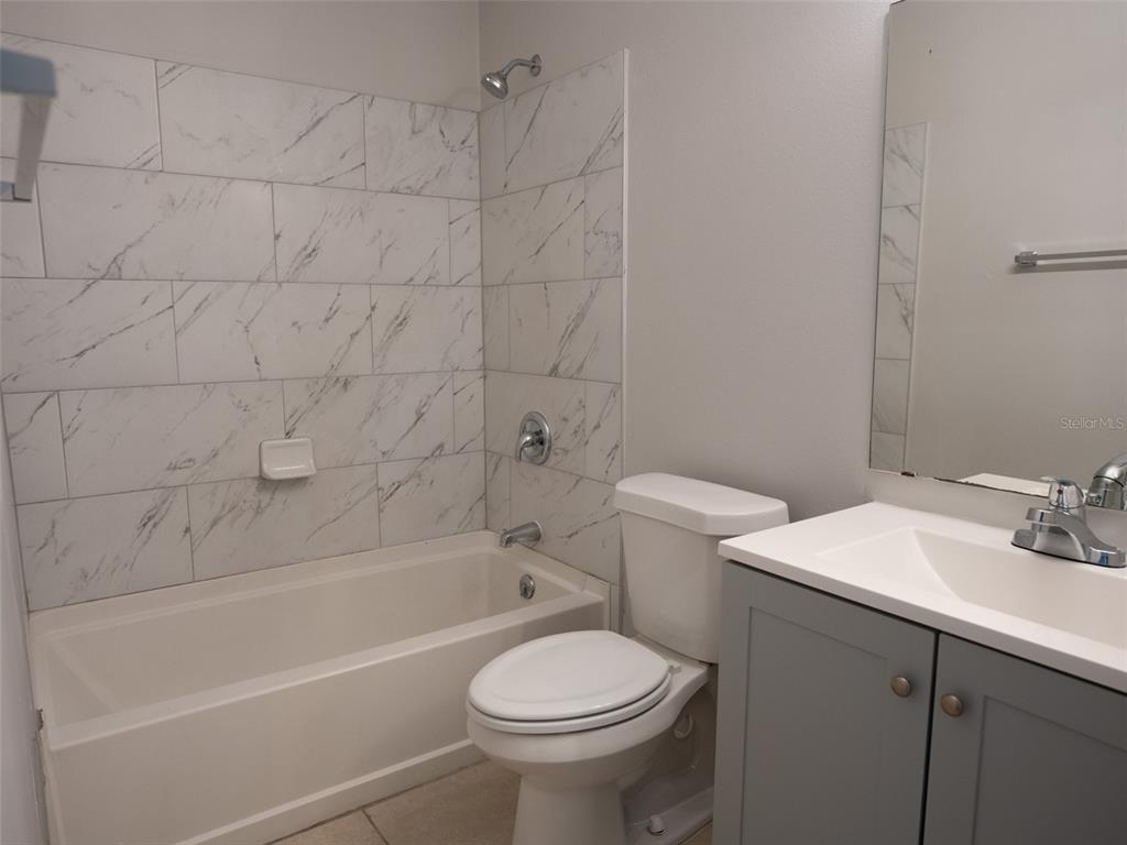 3651 North Goldenrod Road, Unit E205 Winter Park, FL 32792 - Photo 13 of 19 a bathroom with a sink toilet and bathtub