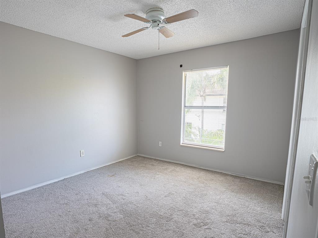 3651 North Goldenrod Road, Unit E205 Winter Park, FL 32792 - Photo 15 of 19 a view of an empty room with a window