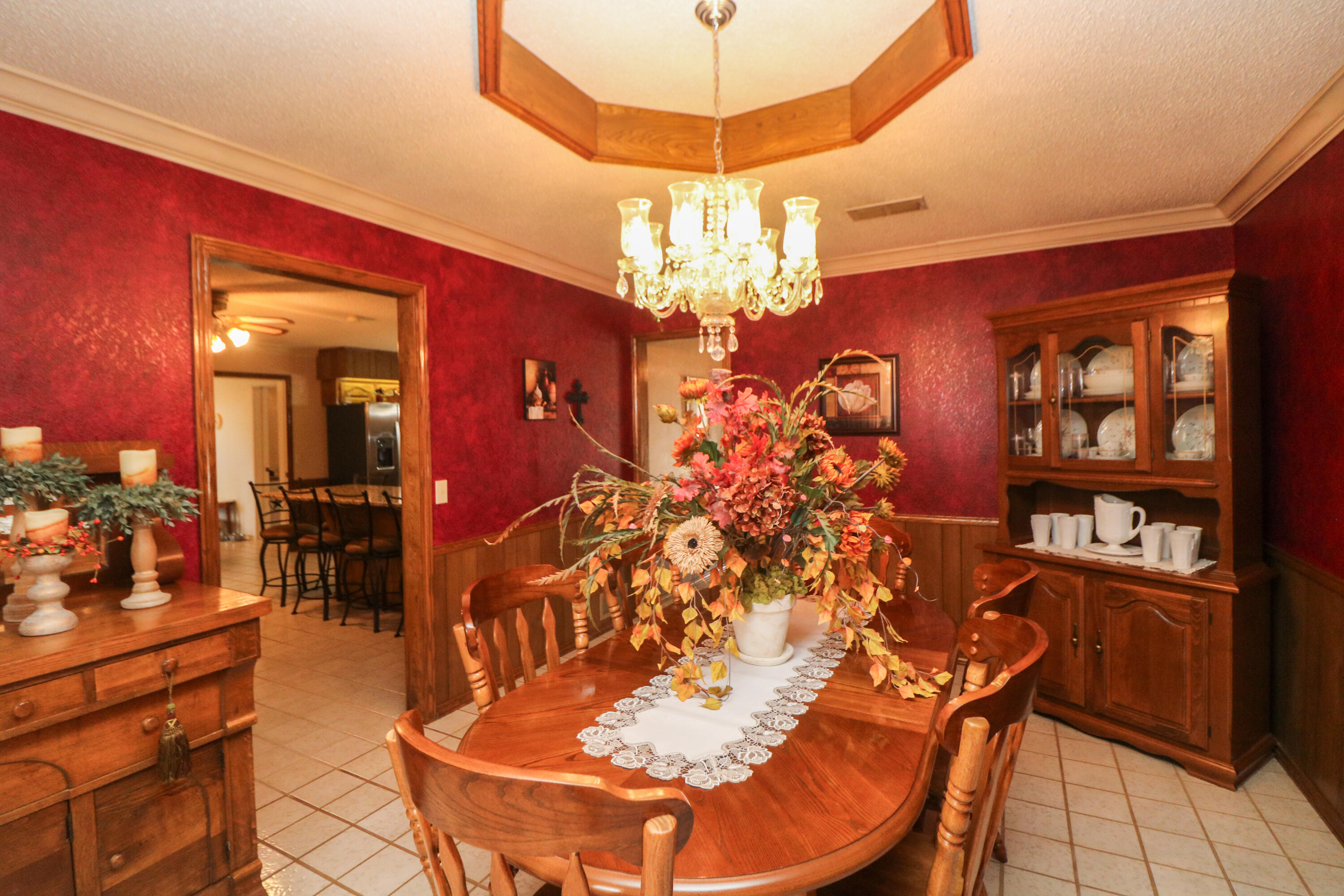 2801 Phelps Avenue Littlefield, TX 79339 - Photo 12 of 38 a view of a dining room with furniture and chandelier