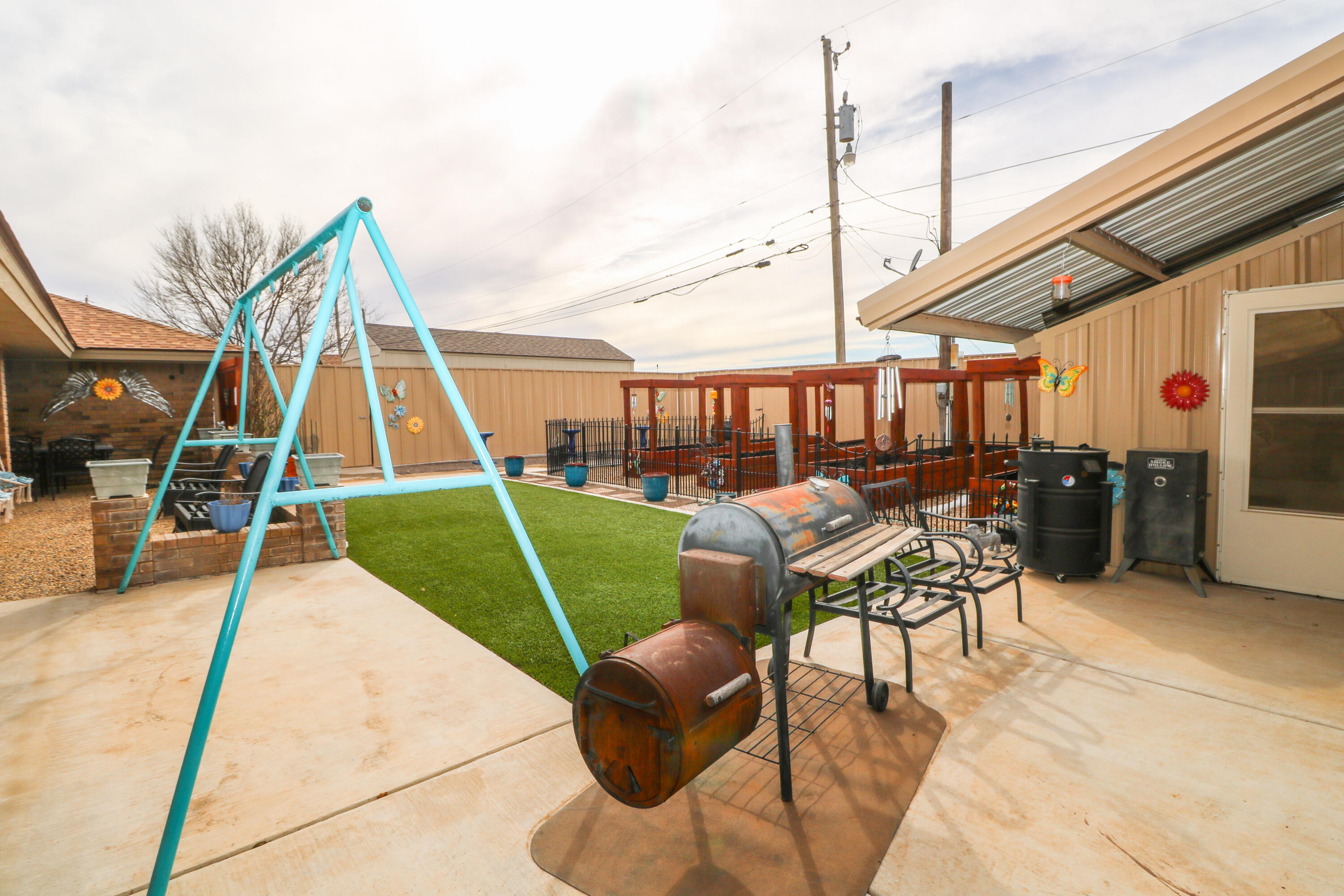 2801 Phelps Avenue Littlefield, TX 79339 - Photo 30 of 38 a view of a backyard with couches chair and tables
