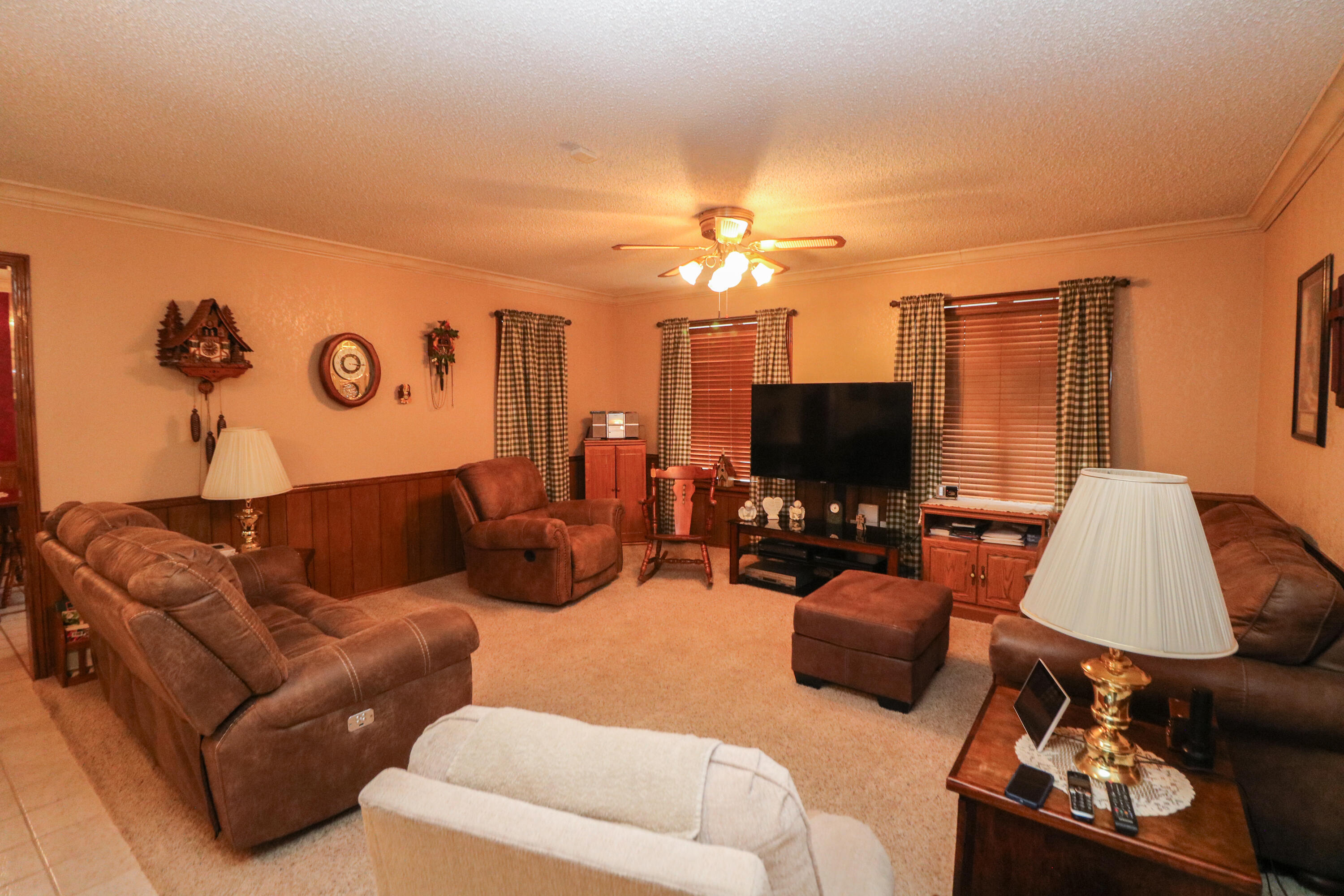 2801 Phelps Avenue Littlefield, TX 79339 - Photo 8 of 38 a living room with furniture kitchen view and a flat screen tv