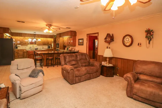 a living room with furniture and a table