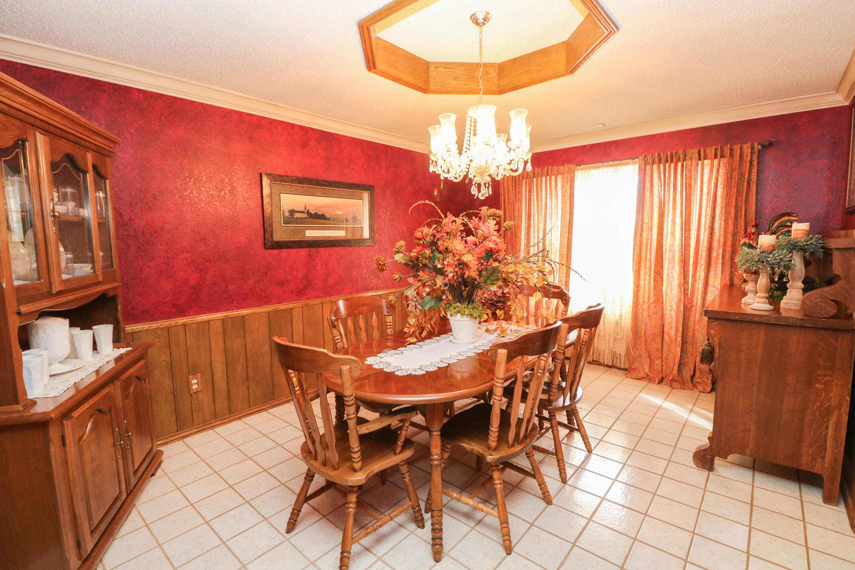 2801 Phelps Avenue Littlefield, TX 79339 - Photo 10 of 38 a view of a dining room with furniture and chandelier