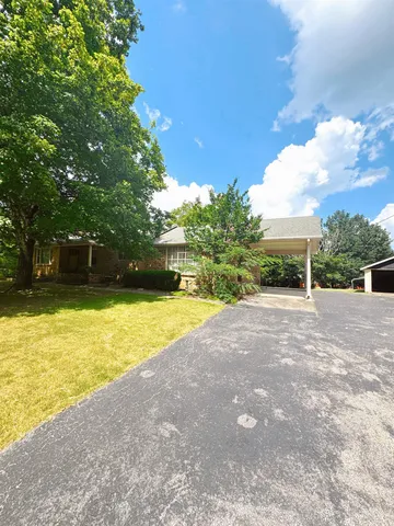 a view of backyard with green space