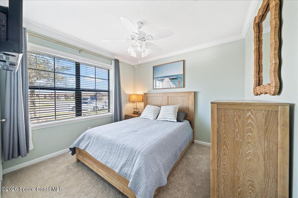7499 Tourmaline Drive Grant, FL 32949 - Photo 21 of 41 a bedroom with a bed and a window