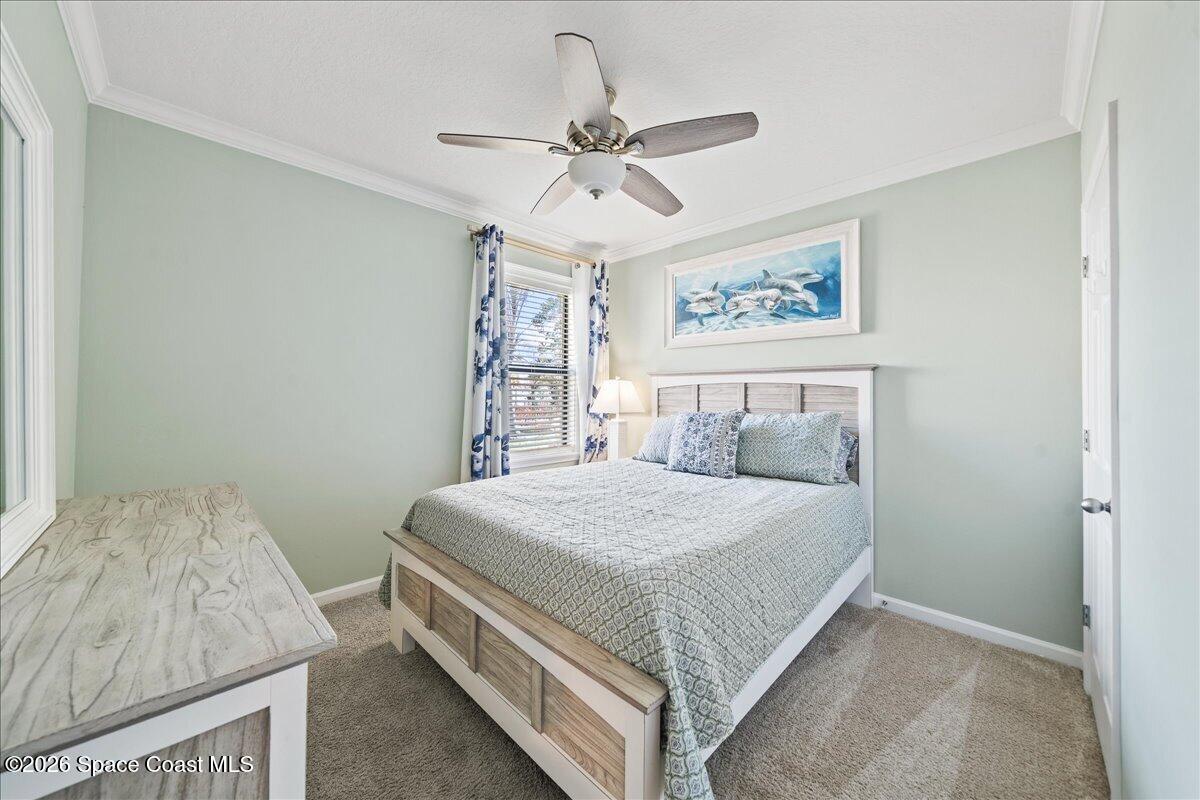 7499 Tourmaline Drive Grant, FL 32949 - Photo 25 of 41 a bedroom with a bed and window