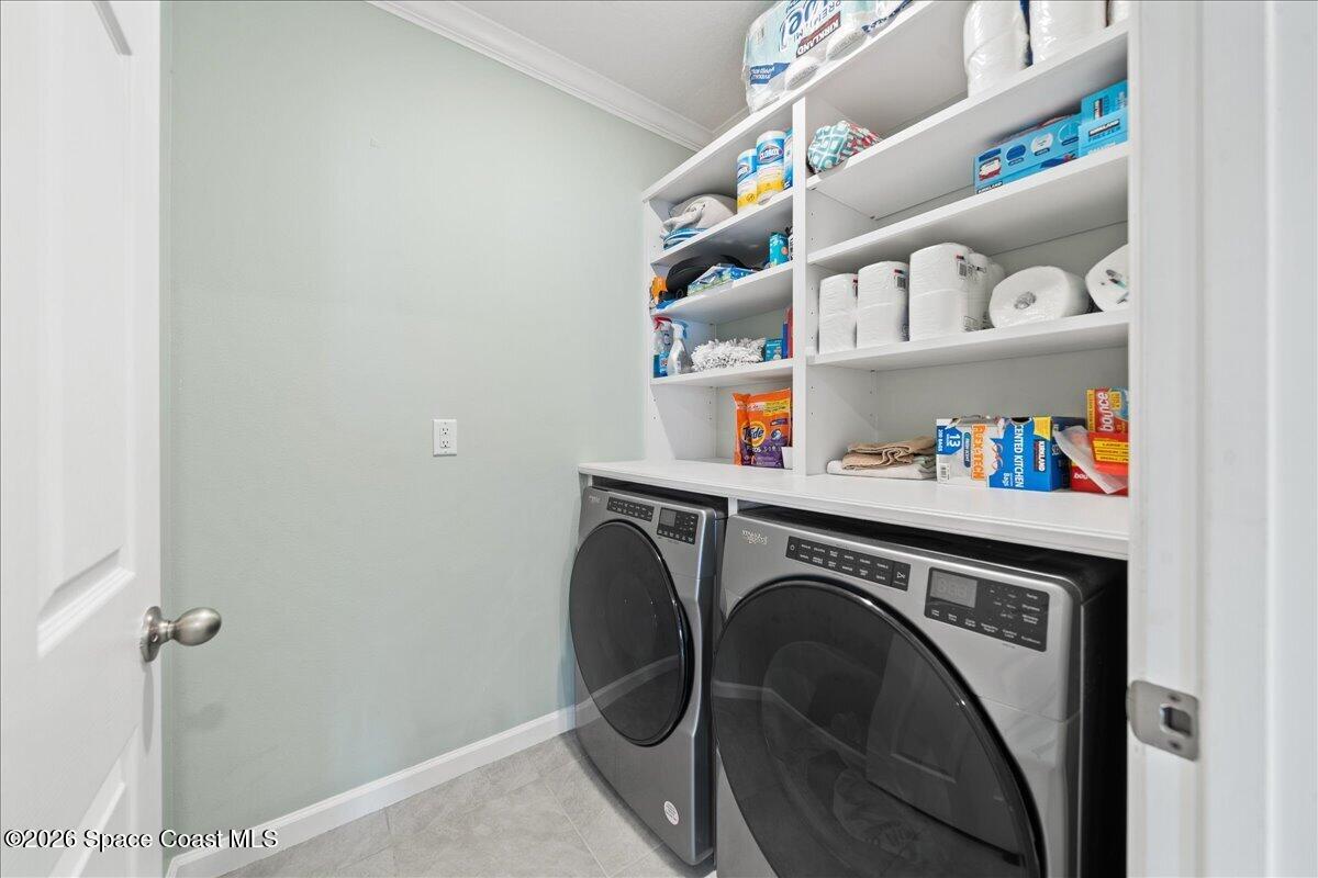 7499 Tourmaline Drive Grant, FL 32949 - Photo 27 of 41 a utility room with dryer and washer
