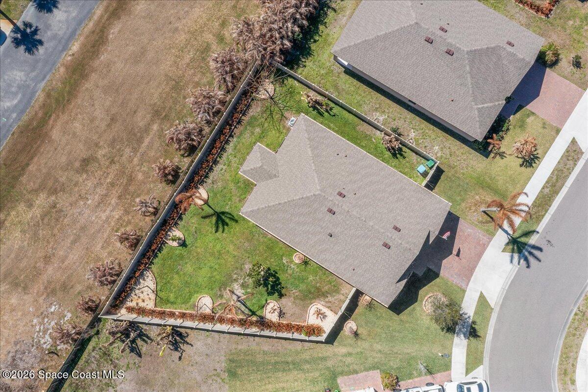 7499 Tourmaline Drive Grant, FL 32949 - Photo 32 of 41 an aerial view of a house with a garden and swimming pool
