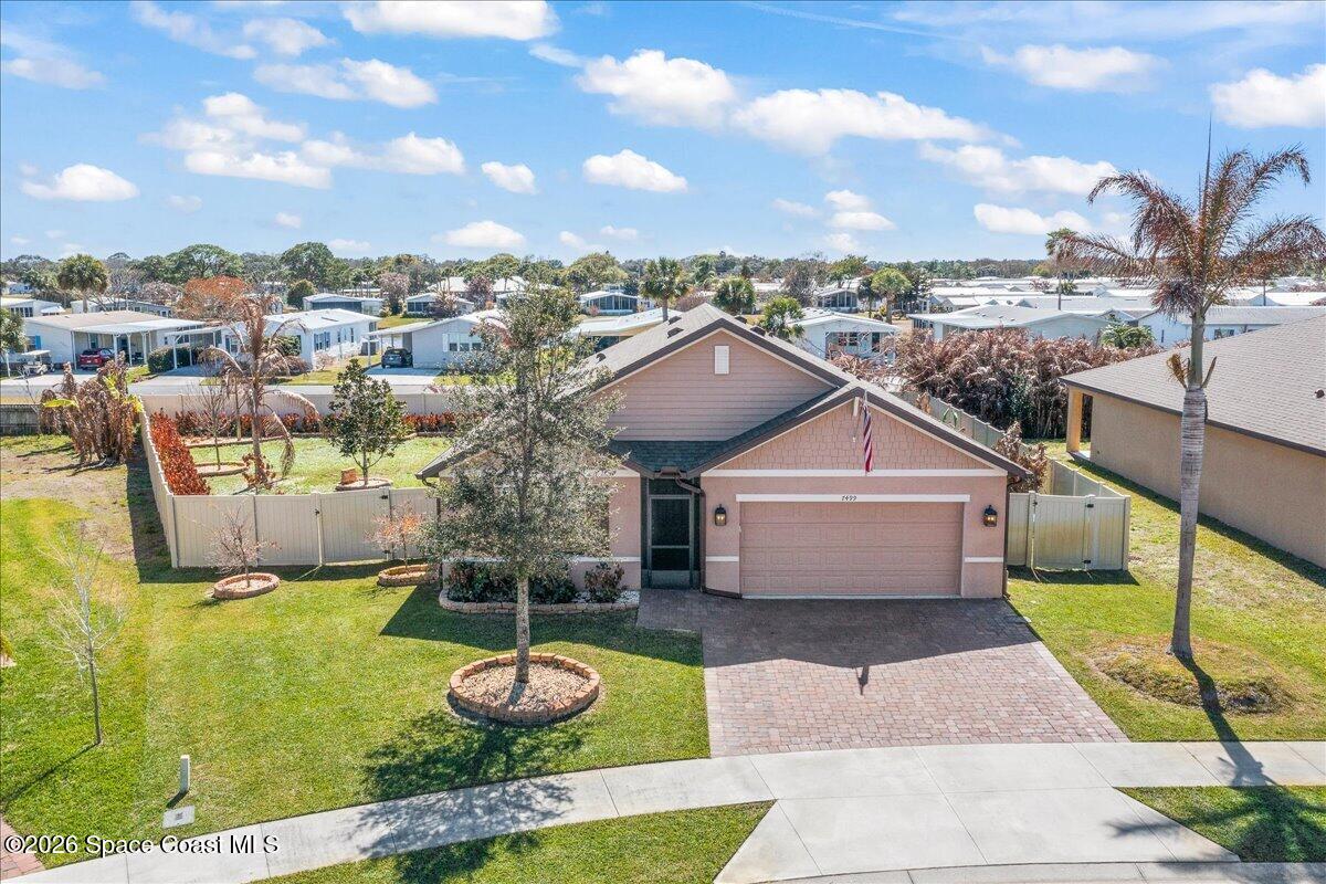 7499 Tourmaline Drive Grant, FL 32949 - Photo 34 of 41 a front view of a house with a yard