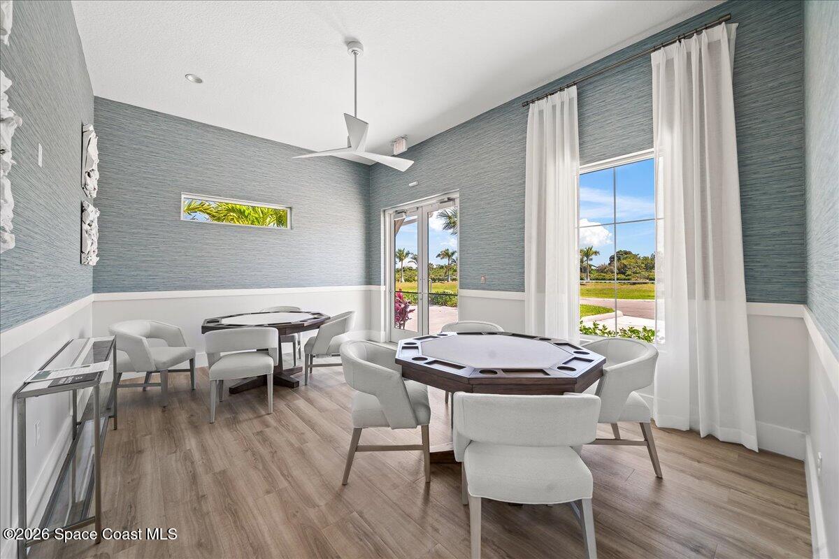 7499 Tourmaline Drive Grant, FL 32949 - Photo 36 of 41 a view of a dining room with furniture wooden floor and chandelier