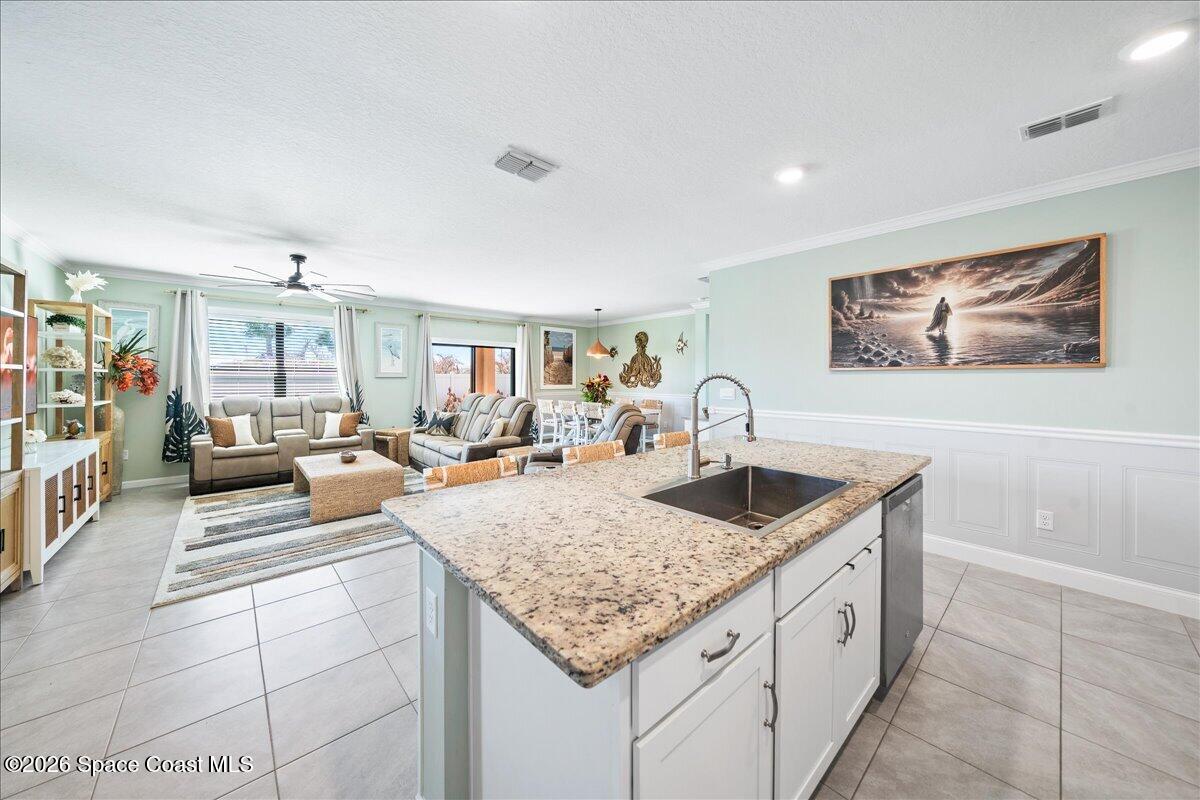 7499 Tourmaline Drive Grant, FL 32949 - Photo 6 of 41 a living room with granite countertop furniture and a rug