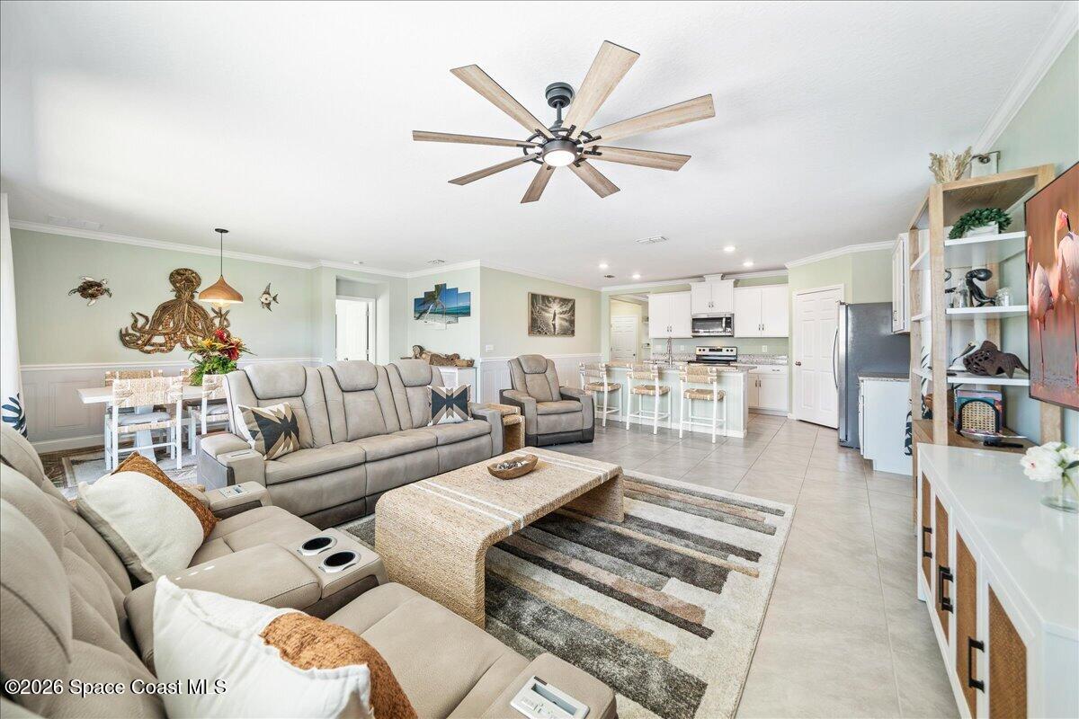 7499 Tourmaline Drive Grant, FL 32949 - Photo 9 of 41 a living room with furniture and a view of kitchen