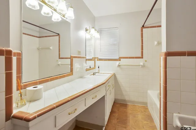 a bathroom with a sink and a mirror