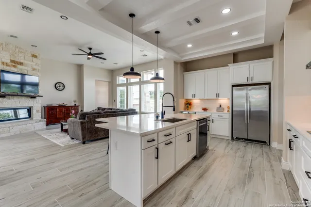 a large kitchen with stainless steel appliances lots of counter top space