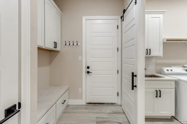 a bathroom with a shower and a sink
