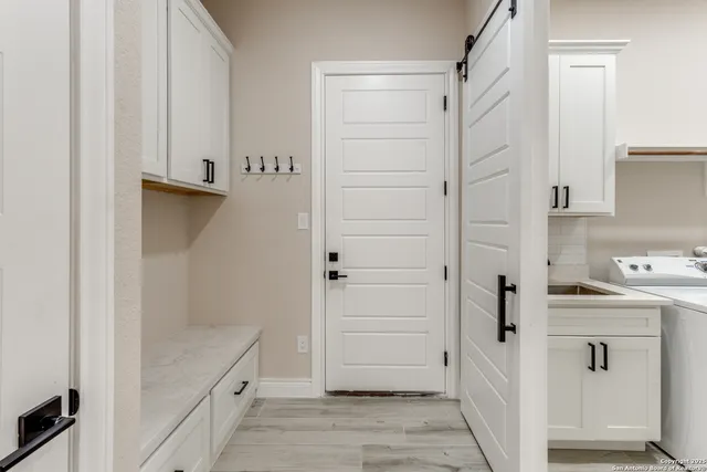 a bathroom with a shower and a sink