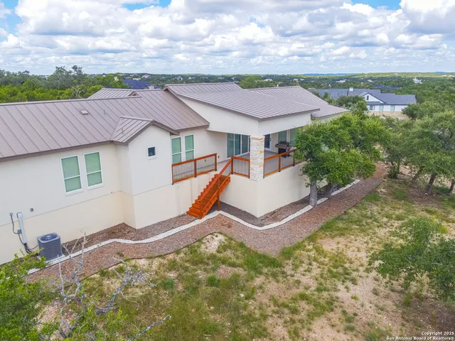 a aerial view of a house with a yard
