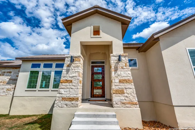 a front view of a house with glass windows
