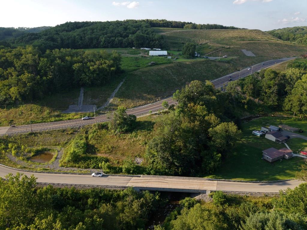 490 Freedom Crider Road Freedom, PA 15042 - Photo 22 of 22 an aerial view of green landscape with trees houses and lake view