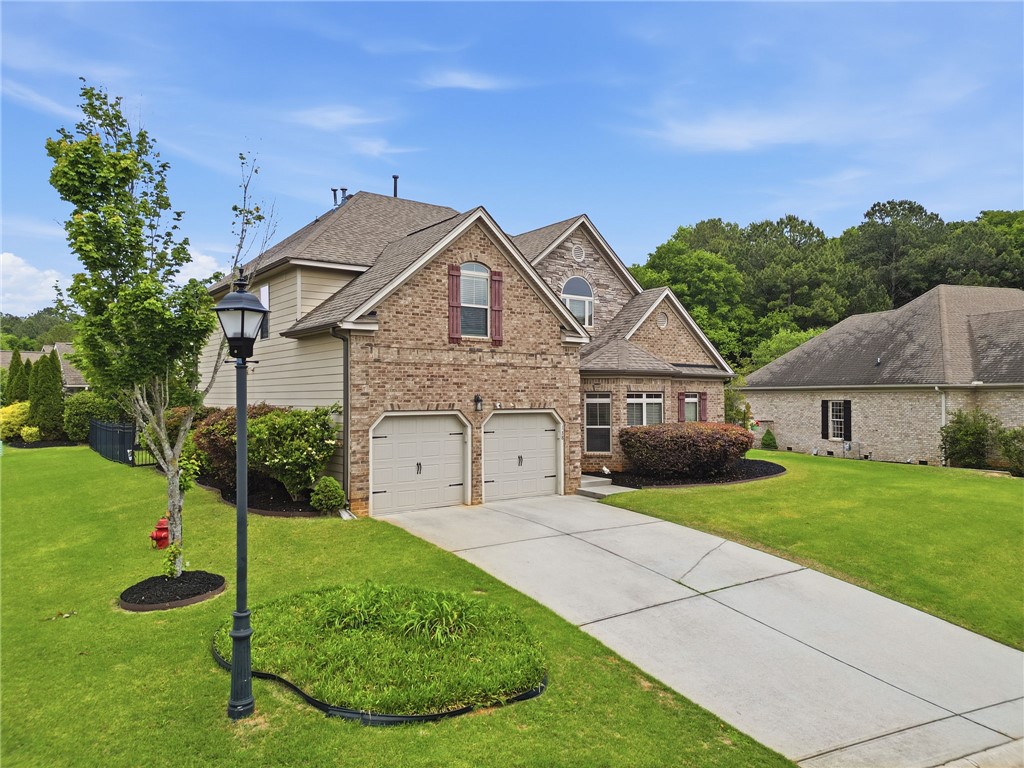 138 Buckland Drive Anderson, SC 29621 - Photo 2 of 49 A classic brick exterior and spacious driveway define this inviting residence.