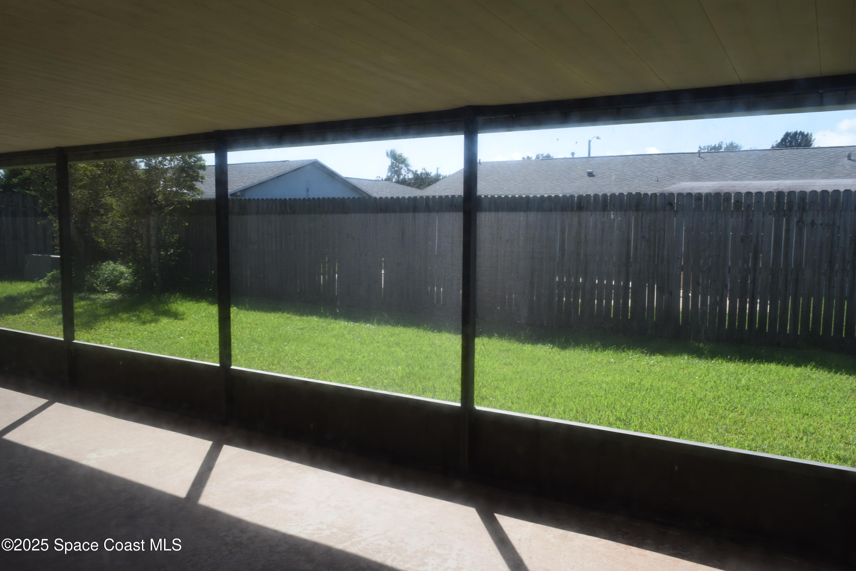 1941 Talloak Road Melbourne, FL 32935 - Photo 11 of 34 a view of a porch with a yard