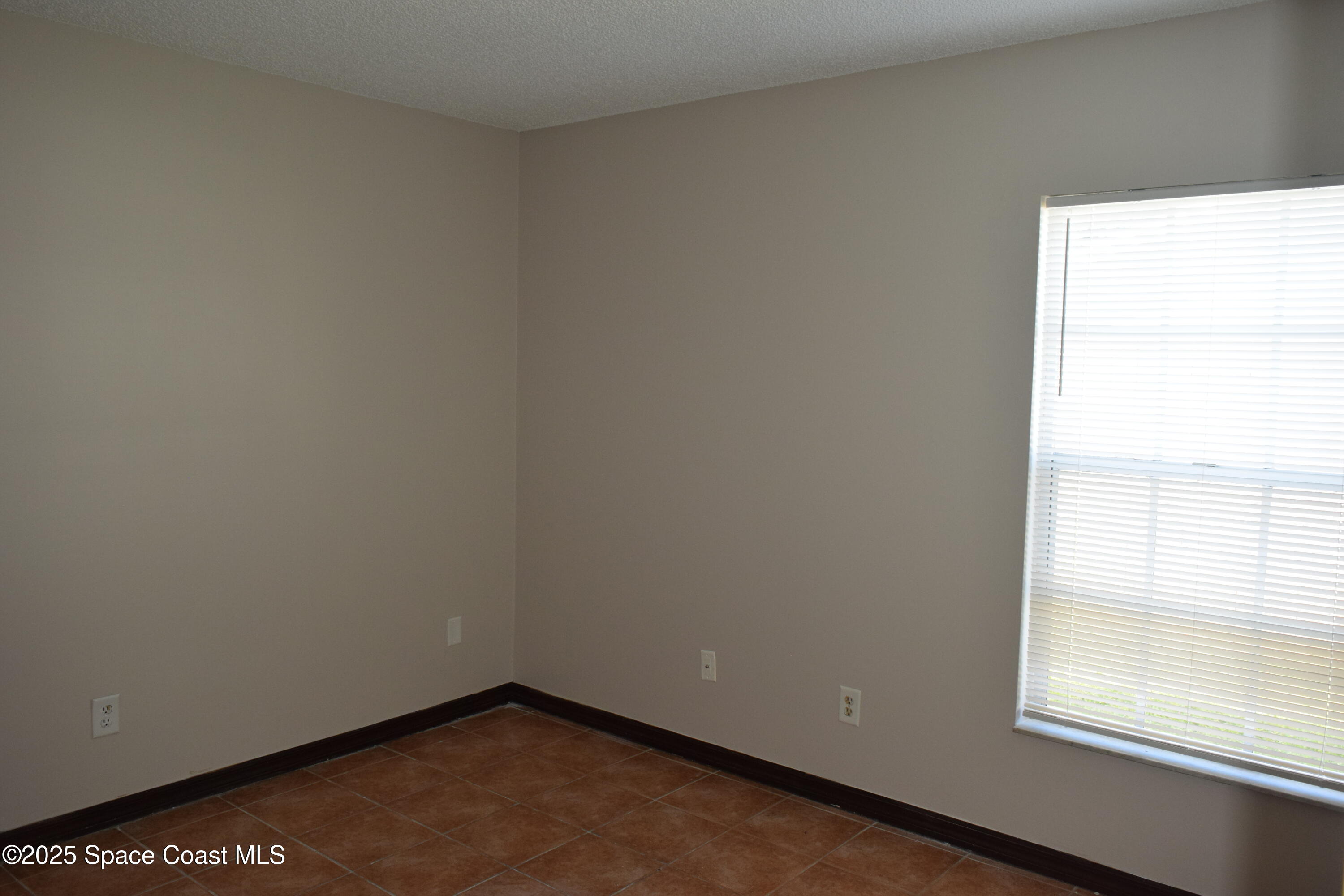 1941 Talloak Road Melbourne, FL 32935 - Photo 17 of 34 a view of a small space with a window