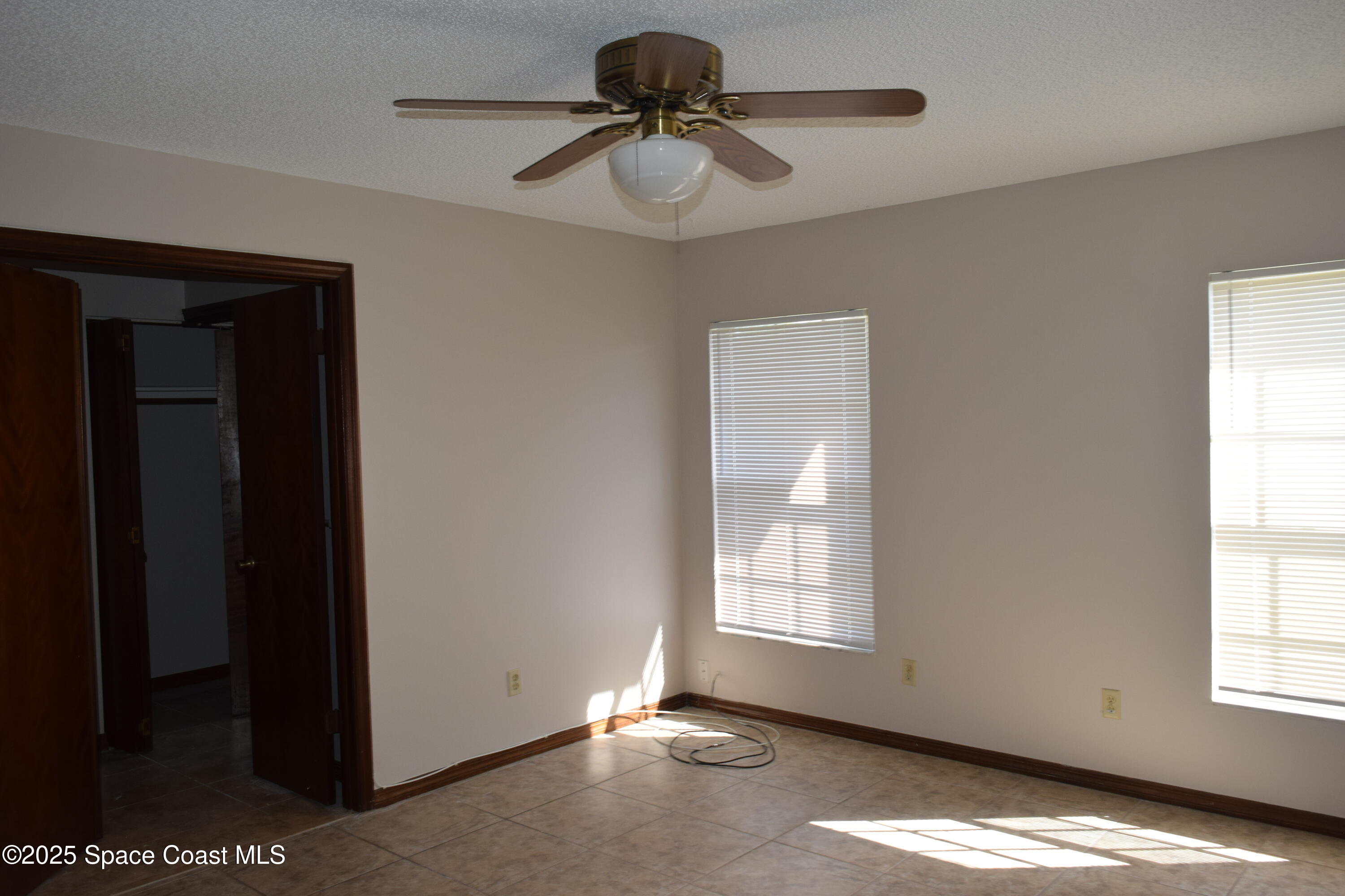 1941 Talloak Road Melbourne, FL 32935 - Photo 21 of 34 a view of livingroom with window