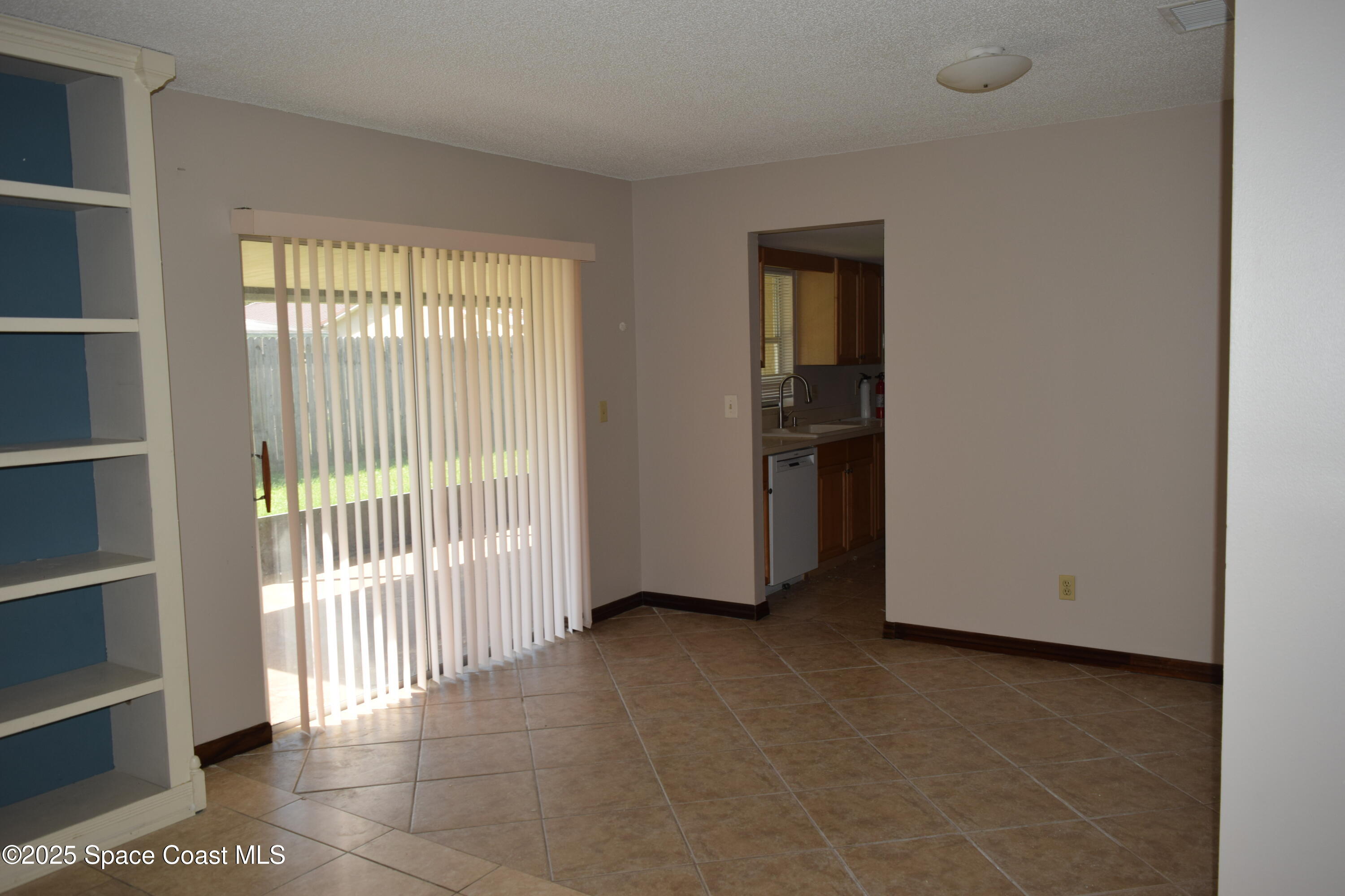 1941 Talloak Road Melbourne, FL 32935 - Photo 24 of 34 a view of an empty room with a window