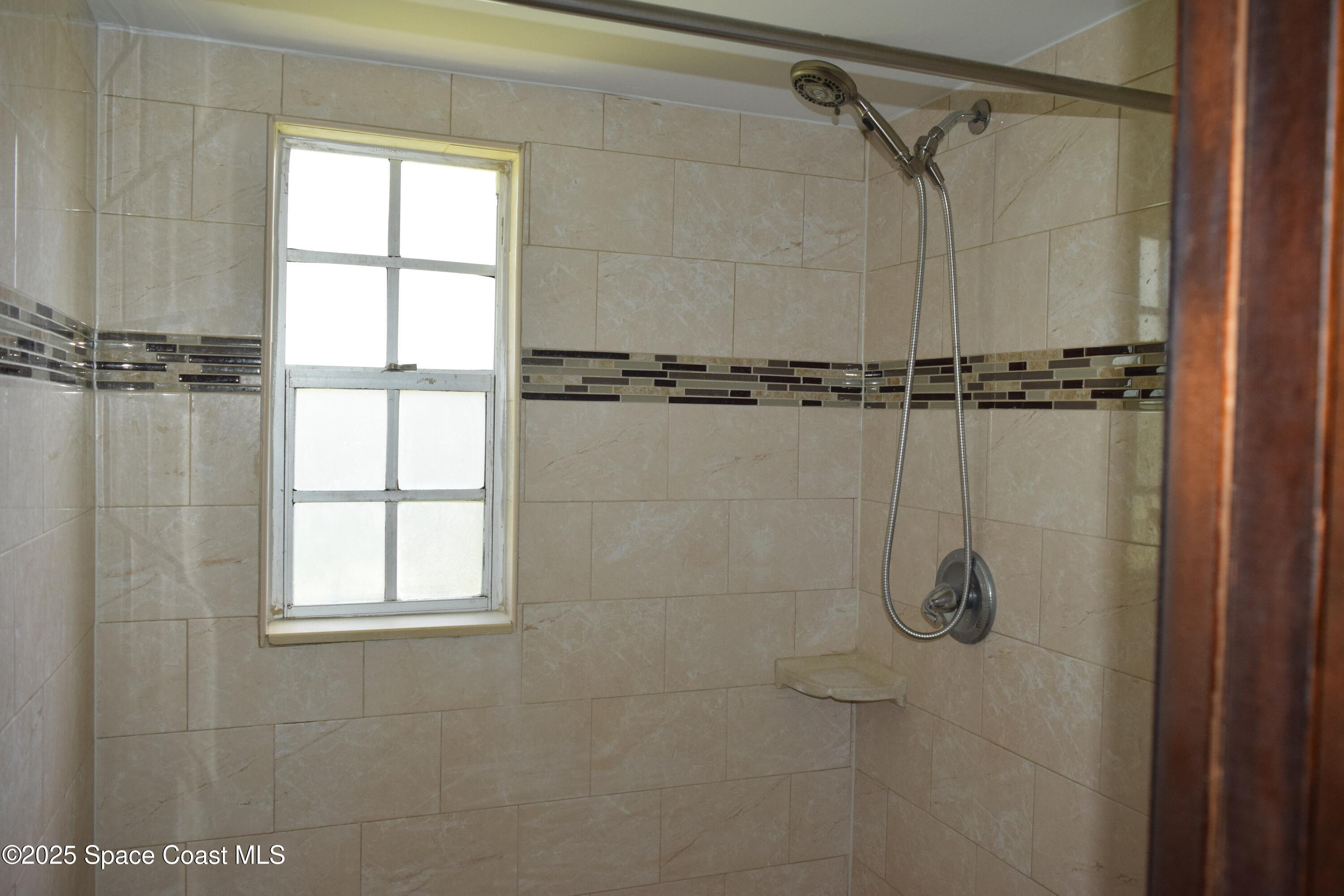 1941 Talloak Road Melbourne, FL 32935 - Photo 29 of 34 a bathroom with a shower