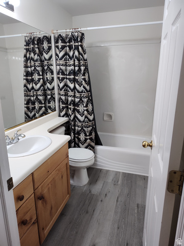 1735 West 540 North, Unit 1402 St. George, UT 84770 - Photo 12 of 14 Full bath with vanity, shower / bathtub combination with curtain, and dark wood-style flooring