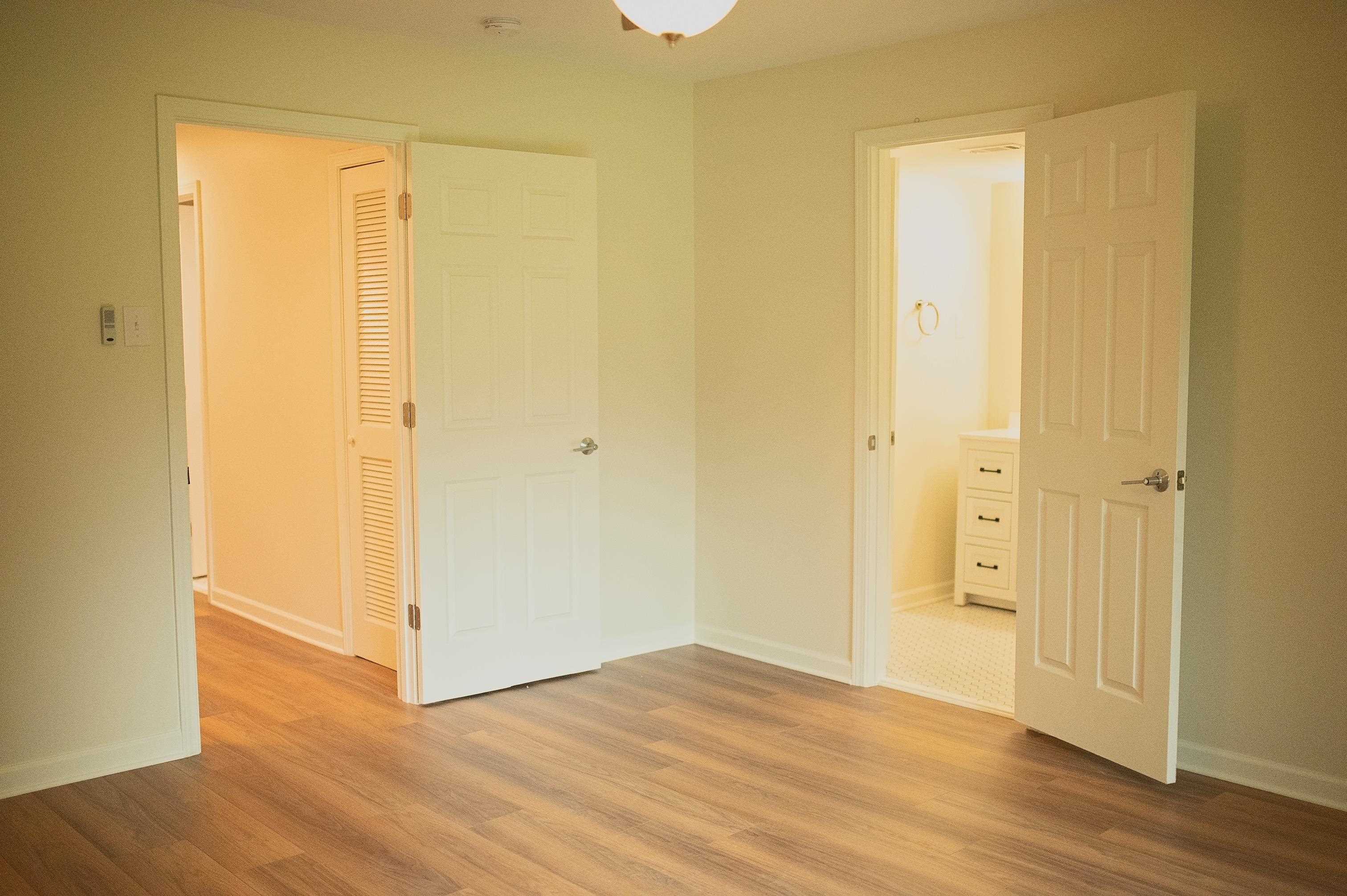3102 Rising Sun Road, Unit 59 Lakeland, TN 38002 - Photo 16 of 29 Entrance to primary bedroom featuring a closet and light hardwood / wood-style floors